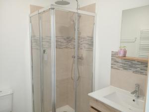 a bathroom with a shower and a sink at Casa Coruja in Ponte da Barca +24 photos