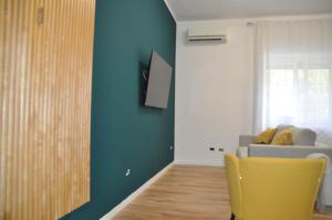 TV a/nebo společenská místnost v ubytování HOSTia