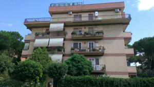 a tall building with balconies and plants on it at Casa Mia a Roma Battistini in Rome