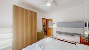 A bed or beds in a room at Vela Latina - By Ligooria