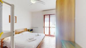 A bed or beds in a room at Vela Latina - By Ligooria