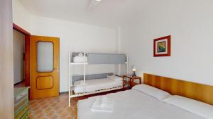 A bed or beds in a room at Vela Latina - By Ligooria