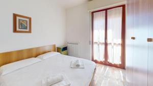 A bed or beds in a room at Vela Latina - By Ligooria