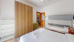 A bed or beds in a room at Vela Latina - By Ligooria
