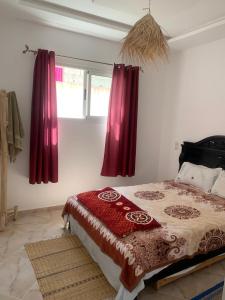 Giường trong phòng chung tại Dar Sultan Oualidia