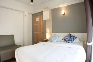 Postel nebo postele na pokoji v ubytování Prix Hotel