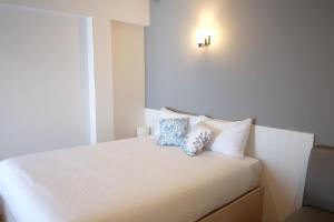Postel nebo postele na pokoji v ubytování Prix Hotel