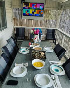 a table with plates and bowls of food on it at La Samba in Crisan