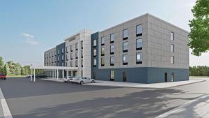 a rendering of a building with a parking lot at Cambria Hotel Plymouth in Plymouth