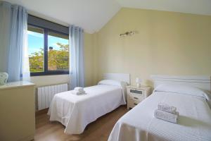 Ένα ή περισσότερα κρεβάτια σε δωμάτιο στο Villa Loreto