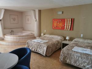 Postel nebo postele na pokoji v ubytování Hotel Castellverd