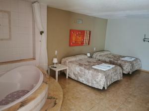 Postel nebo postele na pokoji v ubytování Hotel Castellverd