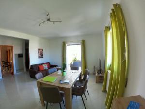a living room with a wooden table and a living room at Maison Carmela in Monopoli