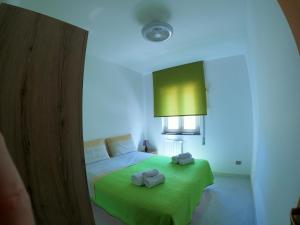a bedroom with a bed with two towels on it at Maison Carmela in Monopoli