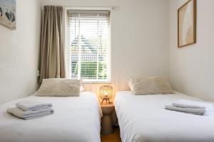 Postel nebo postele na pokoji v ubytování Hello Zeeland - vakantiehuis De elf Boompjes 64