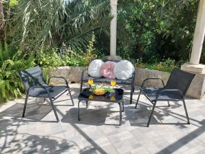 two chairs and a table with a tray of food on a patio at Apartment Ivka in Dubrovnik