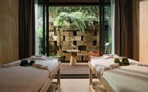 Dinso Resort & Villas Phuket, Vignette Collection by IHG客房内的一张或多张床位