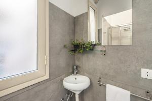 A bathroom at Sant'Agostino Apartment with Terrace by Wonderful Italy