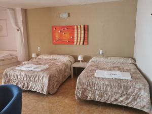 Postel nebo postele na pokoji v ubytování Hotel Castellverd