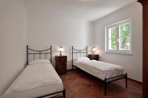 Postel nebo postele na pokoji v ubytování Villa Pomegrana + 37 fotografií