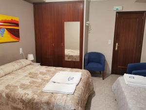 Postel nebo postele na pokoji v ubytování Hotel Castellverd