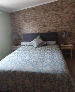 Ein Bett oder Betten in einem Zimmer der Unterkunft Quinta das Hortênsias I Quinta do Sol
