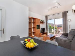 a bowl of fruit on a table in a living room at Apartment Eixample Esq Rocafort Diputacio by Interhome in Barcelona