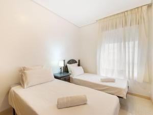 A bed or beds in a room at Apartment Edificio Las Americas by Interhome