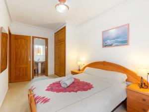 A bed or beds in a room at Apartment Edificio Las Americas by Interhome