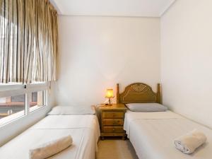 Łóżko lub łóżka w pokoju w obiekcie Apartment Edificio Las Americas by Interhome