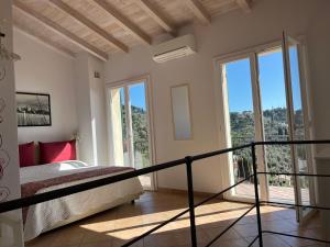 Ένα ή περισσότερα κρεβάτια σε δωμάτιο στο Villa Olivia Residence by PortofinoVacanze