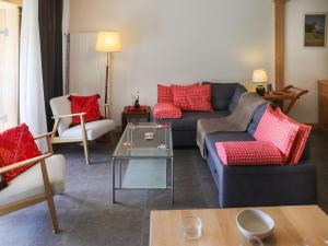 a living room with a couch and a table at Apartment Diamant 6 by Interhome in Villars-sur-Ollon