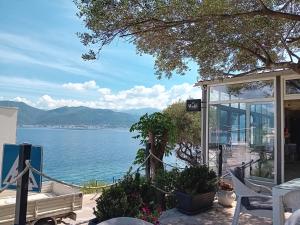 a house with a view of the water at Studio Happy Montenegro in Krašići