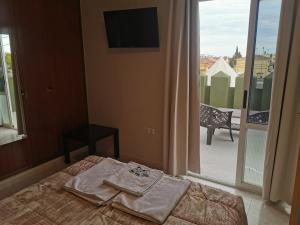 Postel nebo postele na pokoji v ubytování Hotel Castellverd