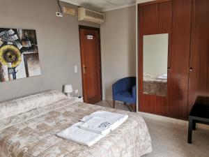 Postel nebo postele na pokoji v ubytování Hotel Castellverd