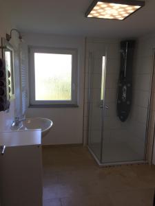 a bathroom with a shower and a sink at Ferienwohnung nähe Spielplatz in Freyung