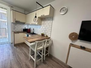 Kuchyňa alebo kuchynka v ubytovaní Rabbit 3 Apartman