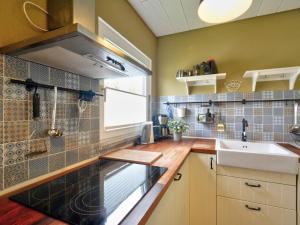 a kitchen with a sink and a counter top at Holiday Home Dorf 4-Haus 10 by Interhome in Kirchheim
