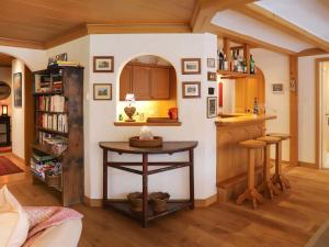 een keuken met een kleine tafel in een kamer bij Apartment Marie-Soleil by Interhome in Gstaad