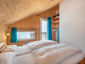 Rúm í herbergi á Chalet Klippitzoase by Interhome