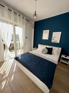 Ένα ή περισσότερα κρεβάτια σε δωμάτιο στο 3C Apartment A Cozy Apartment in the Heart of Alexandroupoli +24 φωτογραφίες