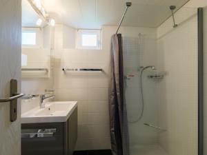 a bathroom with a shower and a sink at Apartment Villaggio Sureggio - App- C1 by Interhome in Lugaggia