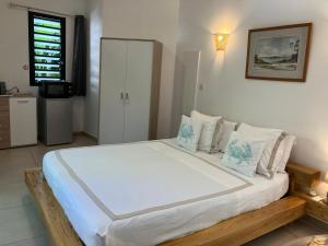 Postel nebo postele na pokoji v ubytování La Carangaise