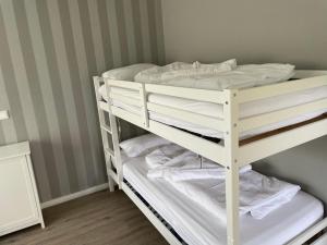 Postel nebo postele na pokoji v ubytování Die lütte Welle Grömitz