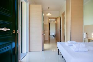 Ένα ή περισσότερα κρεβάτια σε δωμάτιο στο Voula Villa Agios Ioannis 1