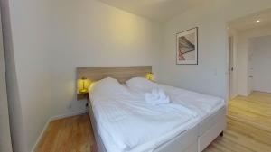 Katil atau katil-katil dalam bilik di 3-BR apartment with a balcony in Frederiksberg - 210