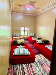 A bed or beds in a room at Gite Tawada