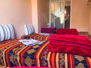 A bed or beds in a room at Gite Tawada