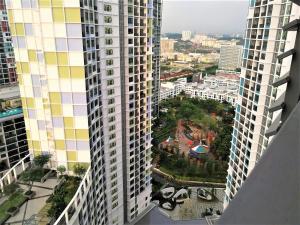 an aerial view of a city with tall buildings at HostaHome Suites at I-City, Central Mall in Shah Alam