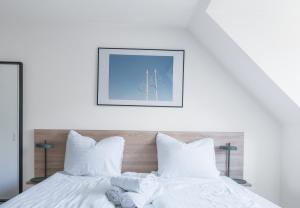a bedroom with two beds with white pillows at Beautiful 1-BR apartment in a fantastic location - 211 in Aarhus